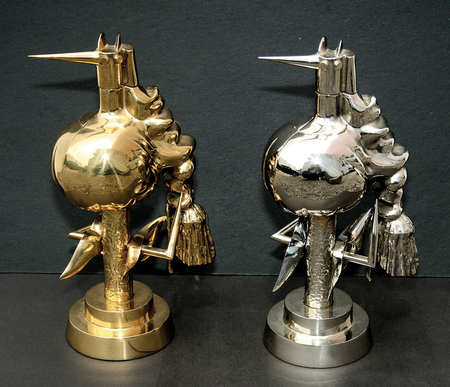 WIFREDO LAM (1902-1982) <br>
Birds of Fire <br>
<i>(P�jaros de Fuego)</i>, 1970 <br>
set of two, polished brass and chrome �
metal plated sculptures, 345 of 500<br>
10 � x 6 x 4 inches
