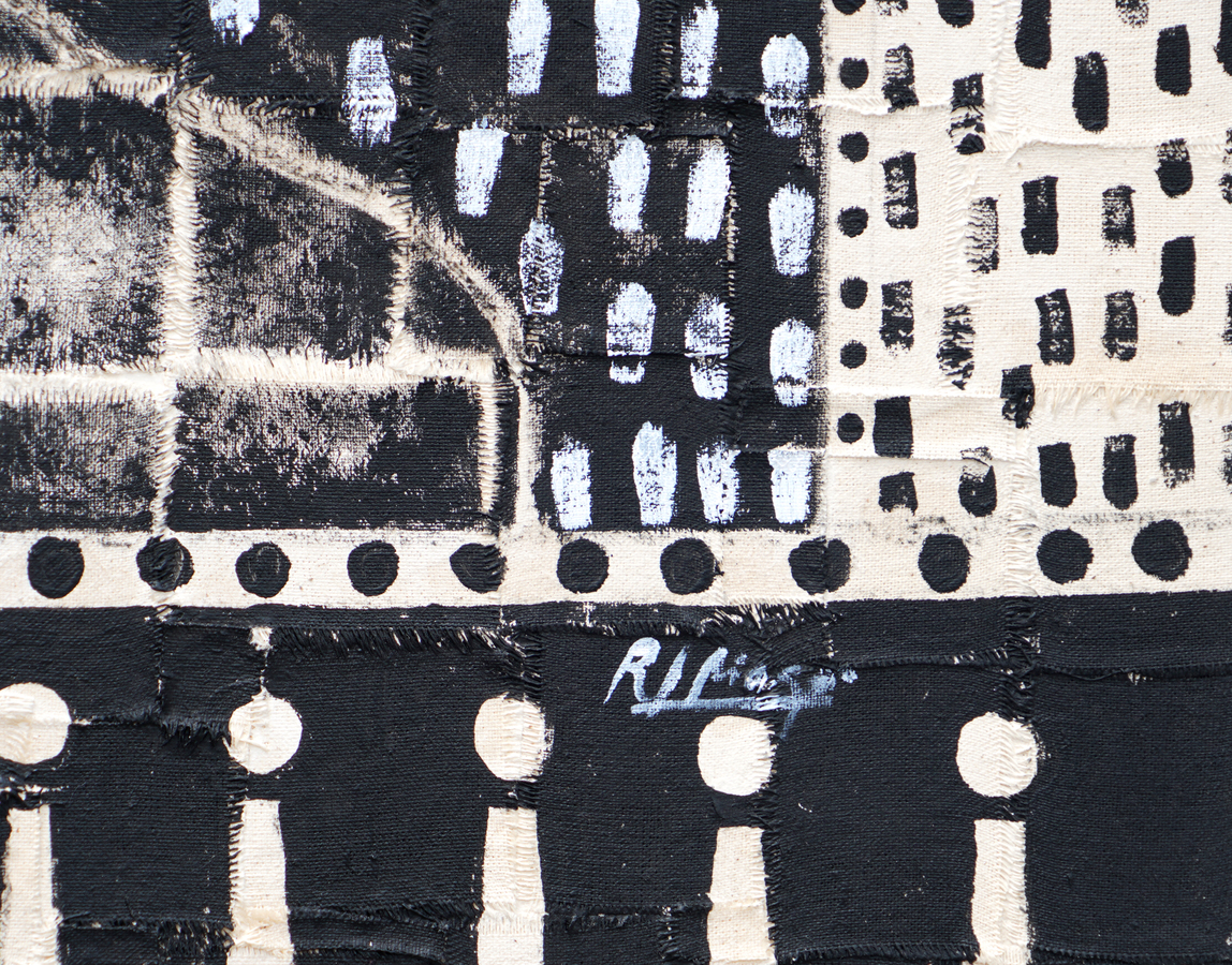 A detail image of Juan Roberto Diago's <I>Born to Live No.1</i>, <br>
showing the artist's signature. </br><br></br><br></br><br></br>