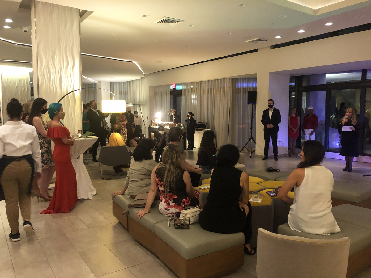Francine Birbragher, Senior Curator of the Art Ovation Hotel, addresses the rapt audience.