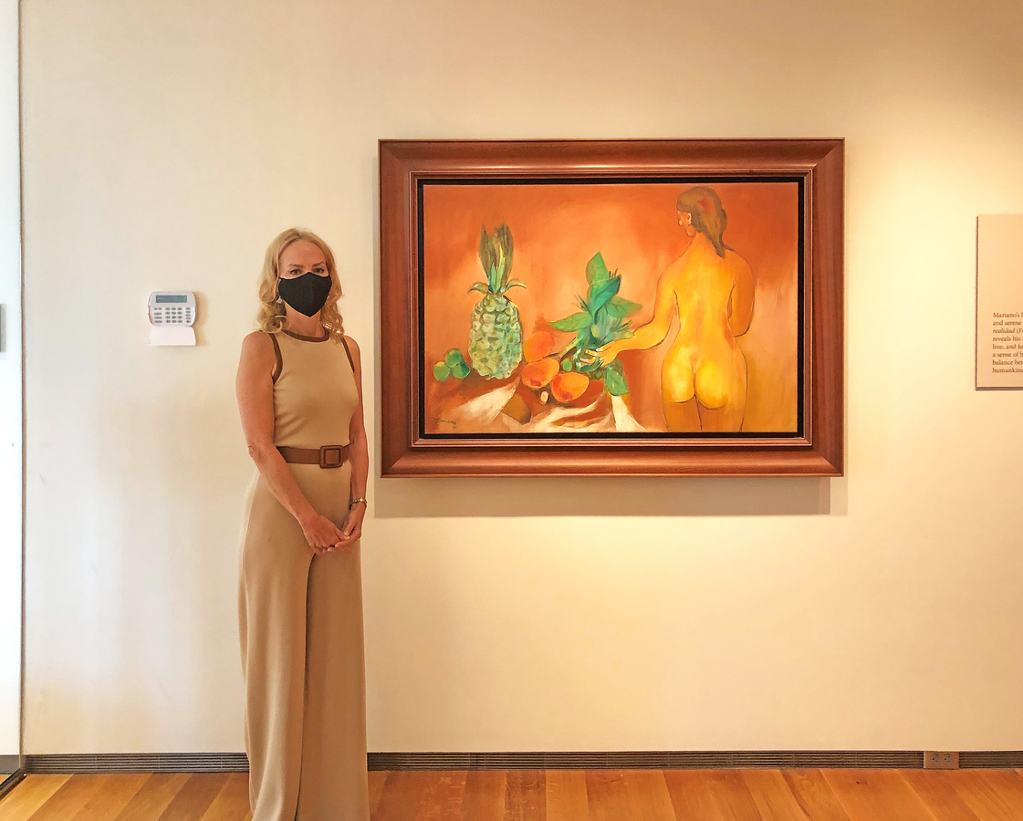 Exhibition curator Elizabeth Goizueta, Ph.D, next to <i>Nude with Fruit,</i> 1980.
<br><br><br>