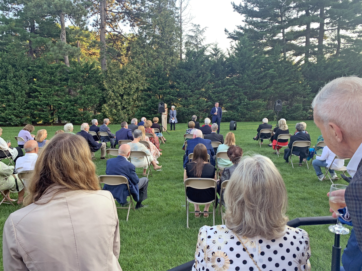 Members, collectors and attendees gathered outside in the museum garden<br> for a celebratory presentation. <br><br><br>